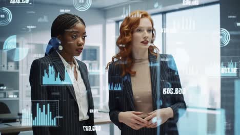 two professional women engaged in insightful discussion amidst data visualizations in a modern office environment, highlighting collaboration and innovation