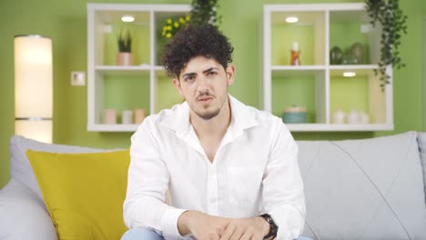 the young man who doesn't find the talk logical. negative head movement.