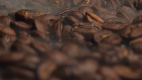 close up of coffee beans fresh roast with smoke, video in 4k, 50fps