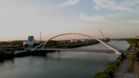 Reveal-Shot-of-Guadalquivir-River-in-Seville-with-Barqueta-and-Alamillo-Bridges