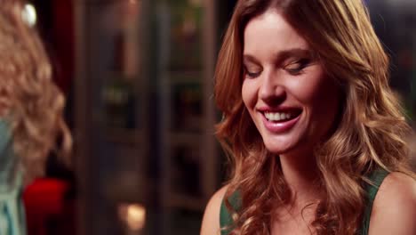 smiling woman drinking cocktail