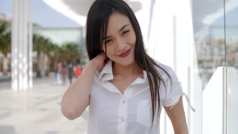 pretty young woman in a white summer top