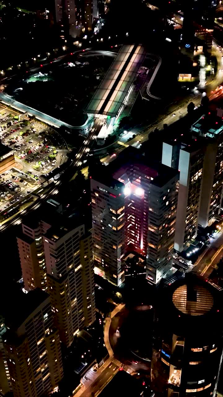 Nighttime hyperlapse vertical drone view of Santa Fe’s skyscrapers