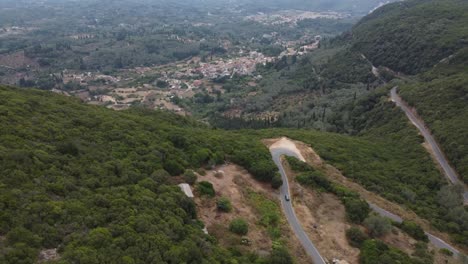 A-Mercedes-car-driving-in-the-mountain-in-Greece