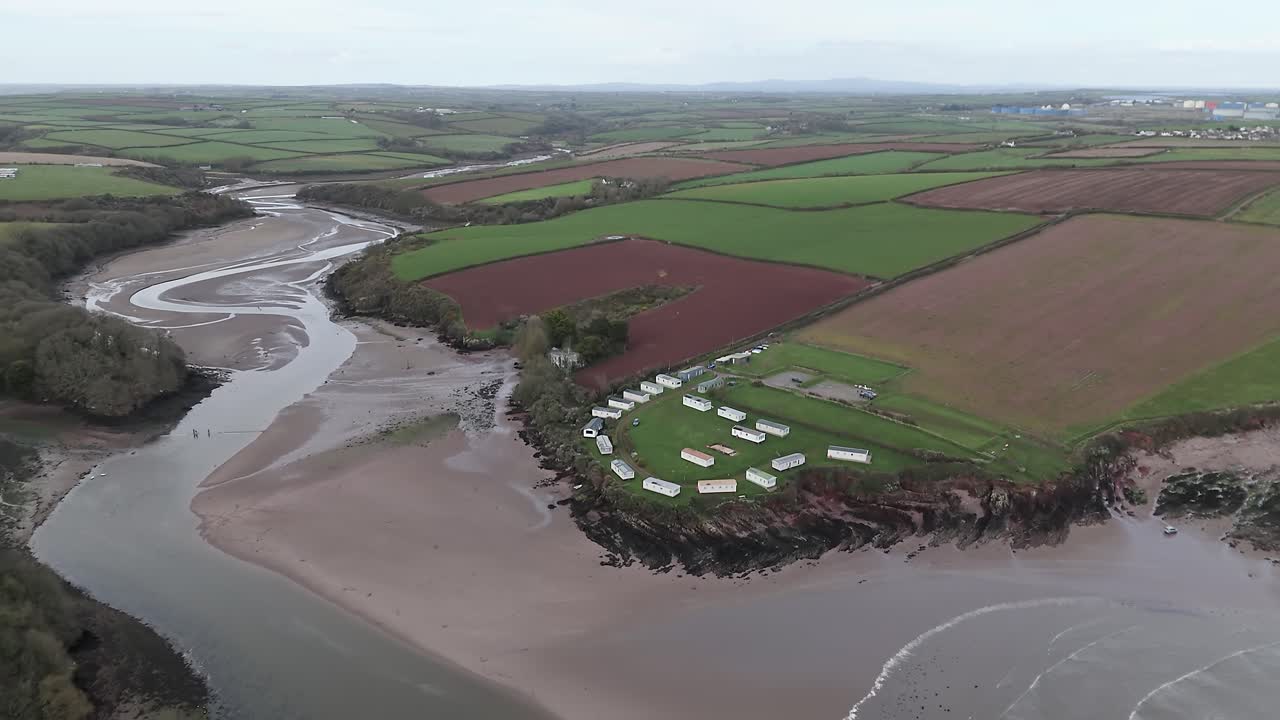 Flyover Sandy Haven Camping Park In Herbrandston, Milford Haven, United Kingdom. Aerial Shot