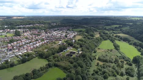 Push-in-aerial-shot-above-Llangollen-towards-old-treatment-works