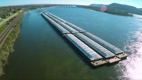 a very good aerial of a large coal barge going up the mississippi river 2