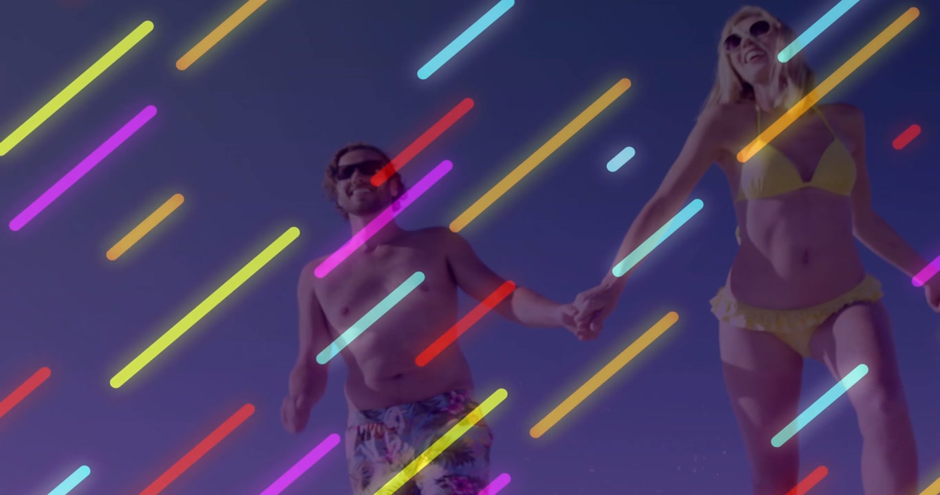 Couple running hand-in-hand toward lens on sand neon overlay onset obscuring for travel