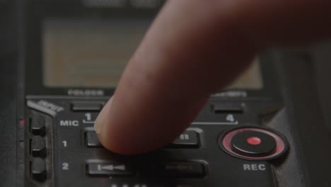 Close-up-of-voice-recorder-being-stopped-by-pressing-on-the-stop-button