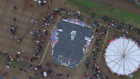 People-waiting-for-launch-of-giant-kite-at-Sumpango-Kite-Festival,-aerial