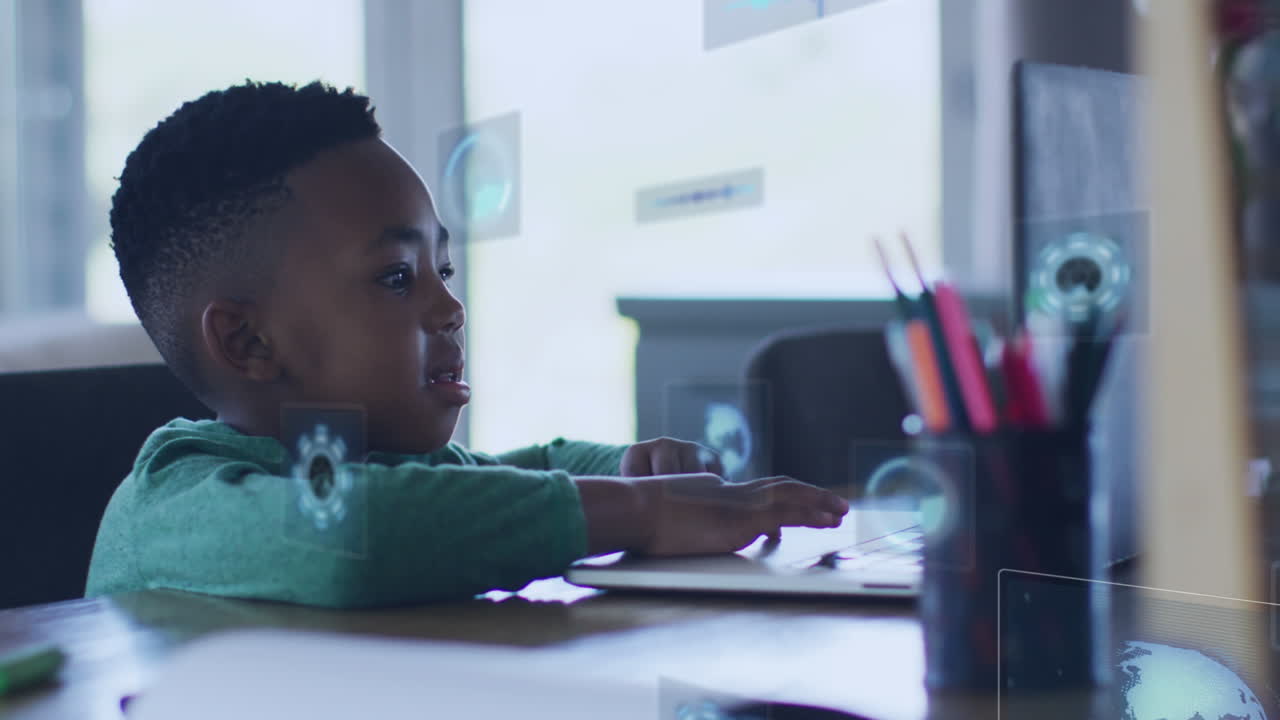 Animation of icons over happy african american boy doing homework