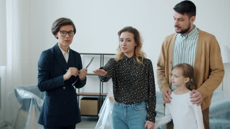 family viewing a new home with a realtor