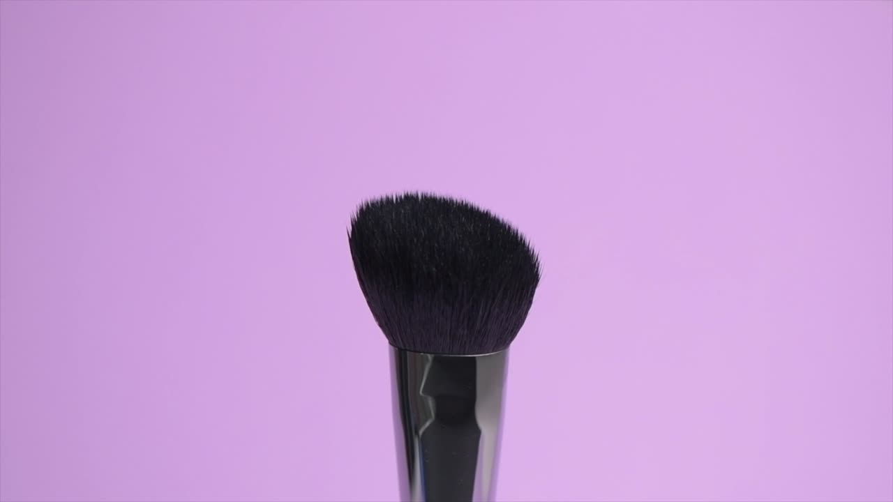 Close-up of a black cosmetic brush.