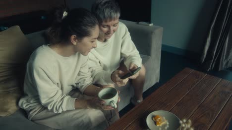 two women enjoying a cozy moment together
