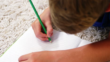 drawing kid lying on the floor