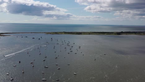 Aerial-drone-shot-from-right-to-left,-showing-Dawlish-Warren-Spit,-the-Exe-Estuary-and-Exmouth,-in-Devon-,-UK