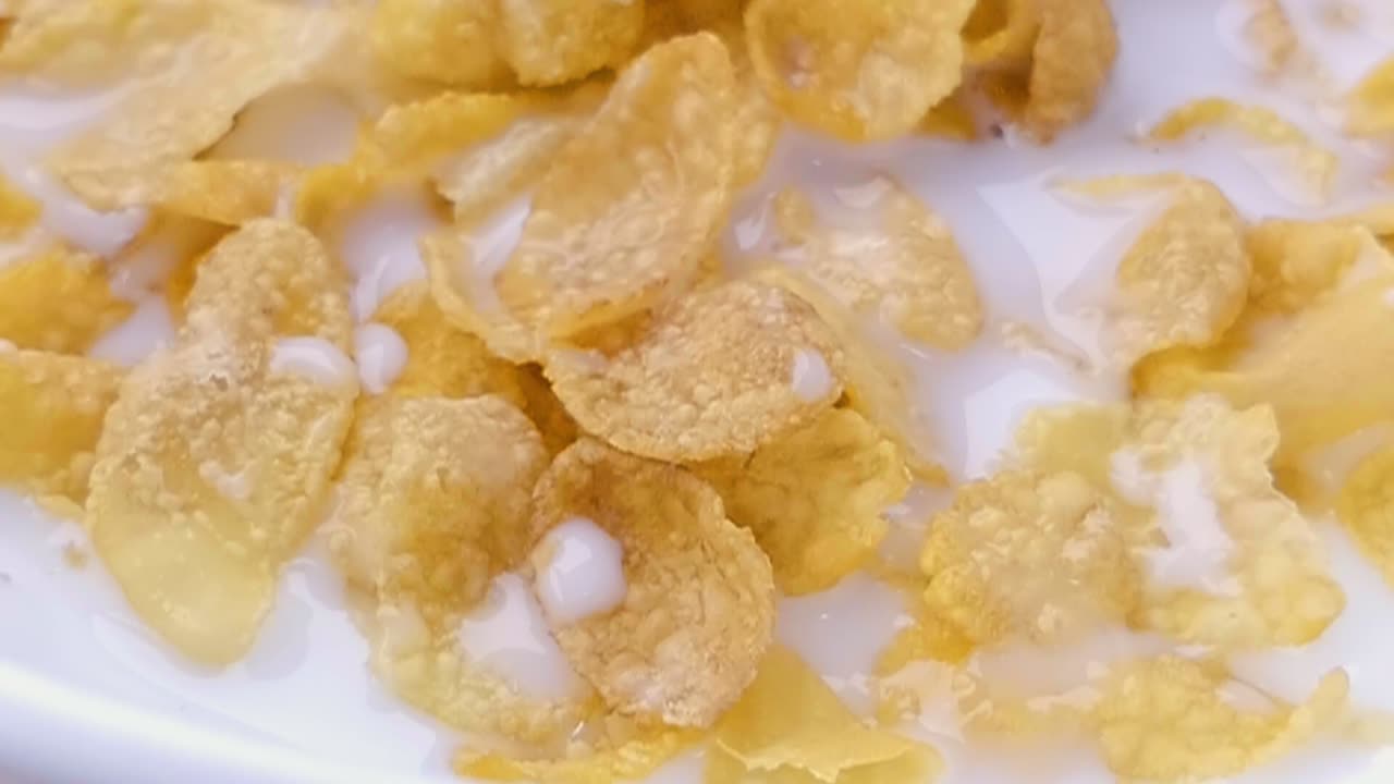 Slider Shot of Milk on Cereal in a Bowl