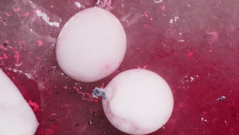 white color circle shaped texture flowing on red liquid medium