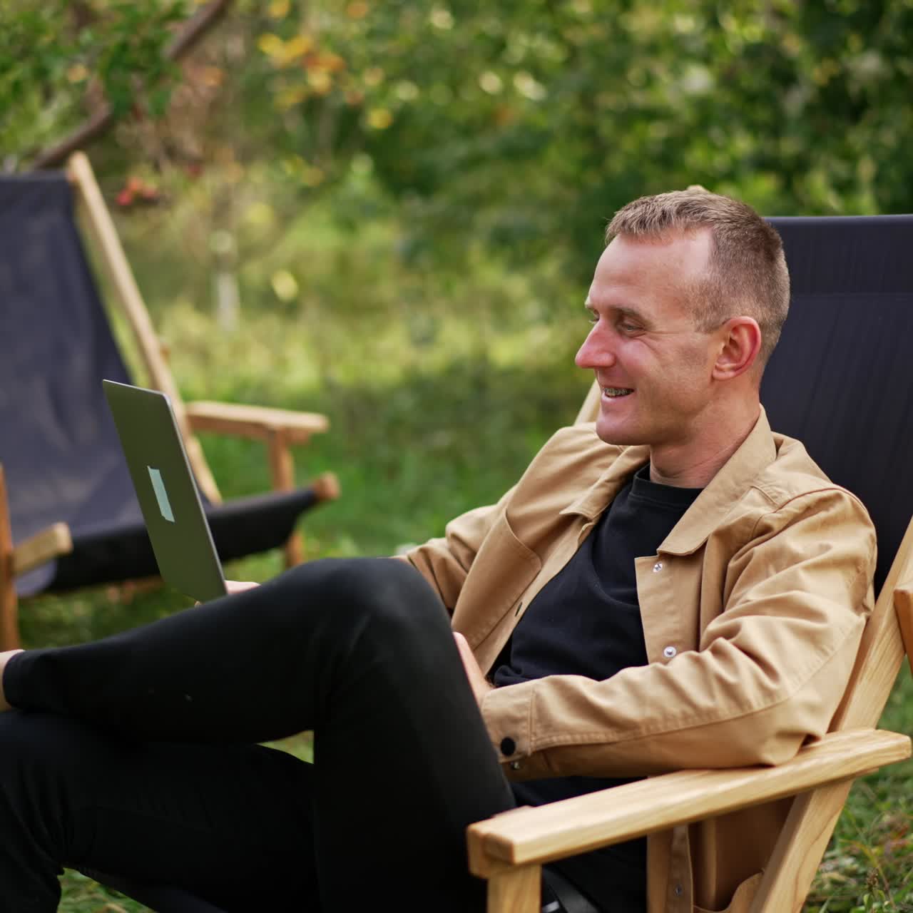 Computer working man in green nature garden. Professional manager with latop outdoor