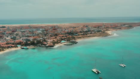 beachfront hotels at santa maria resort in cabo verde, sal island, africa. aerial drone shot