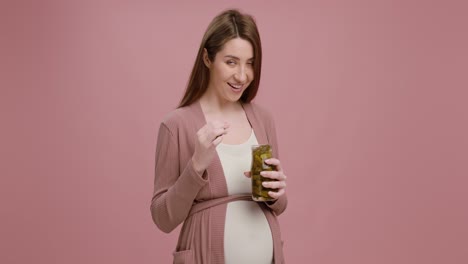 pregnant woman eating pickles