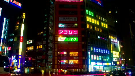 night lapse with japanese neons at shinjuku south side wide shot zoom out