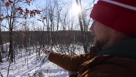 birds landing on man's hand to fee wide angle winter slomo