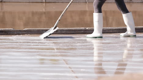 Cropped-Image-Of-A-Person-Working-On-Salt-Farm-At-Salinas-de-Rio-Maior-In-Portugal