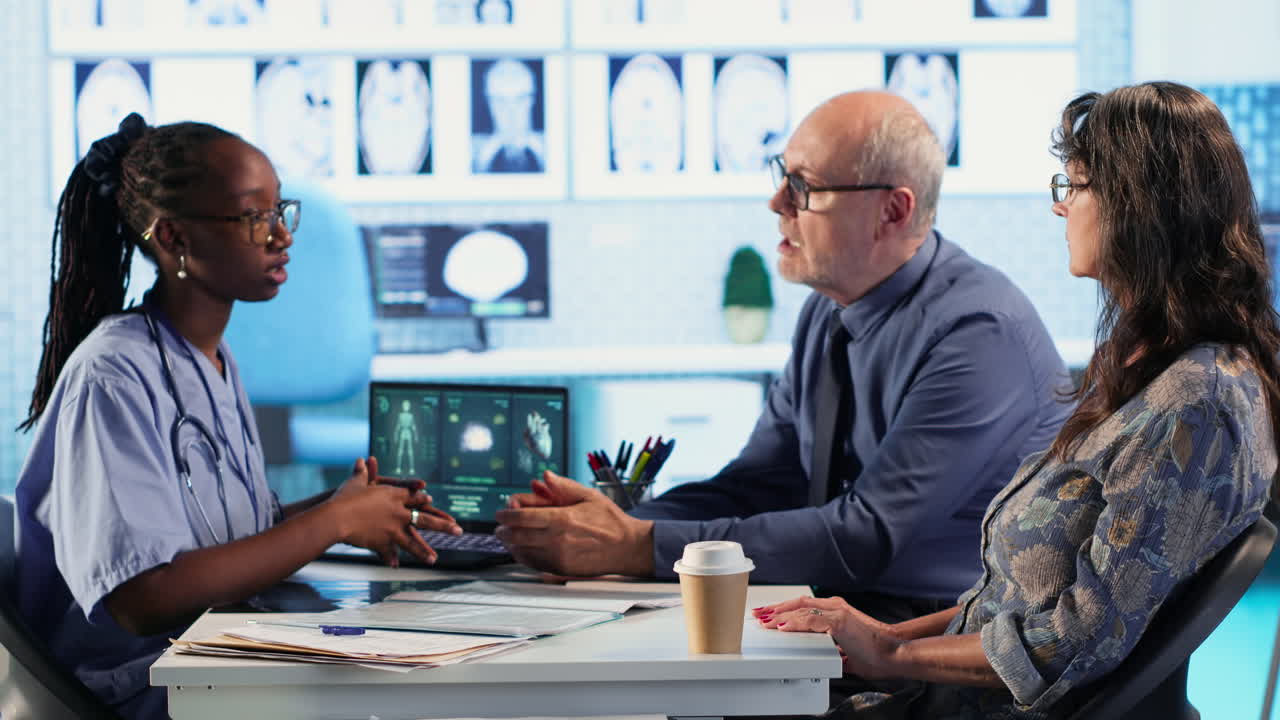 Vertical Video Medical assistant consulting senior patients about test results and MRI scans