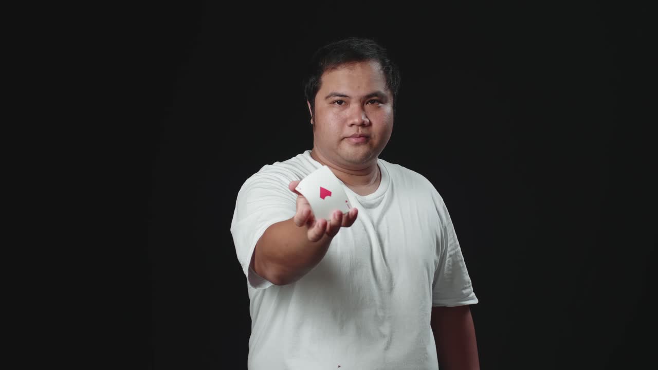 Asian Magician Is Making Trick Shaking Hand And Changing Card