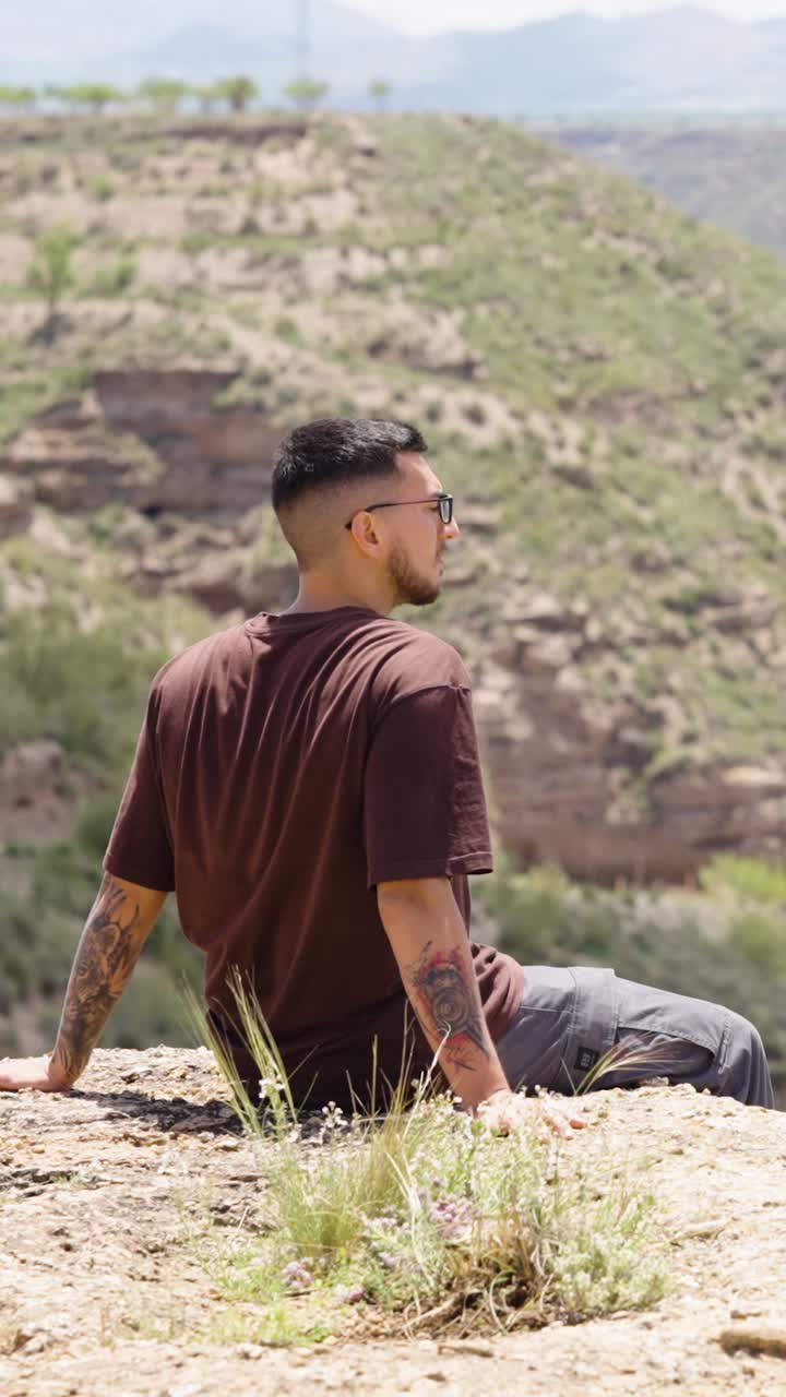 Tourist enjoying the view of gorafe desert in spain. Vertical