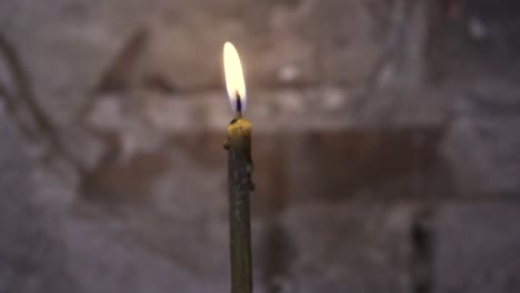 burning candle in a church