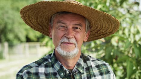 Close-up-video-portrait-of-farmer-in-a-straw-hat