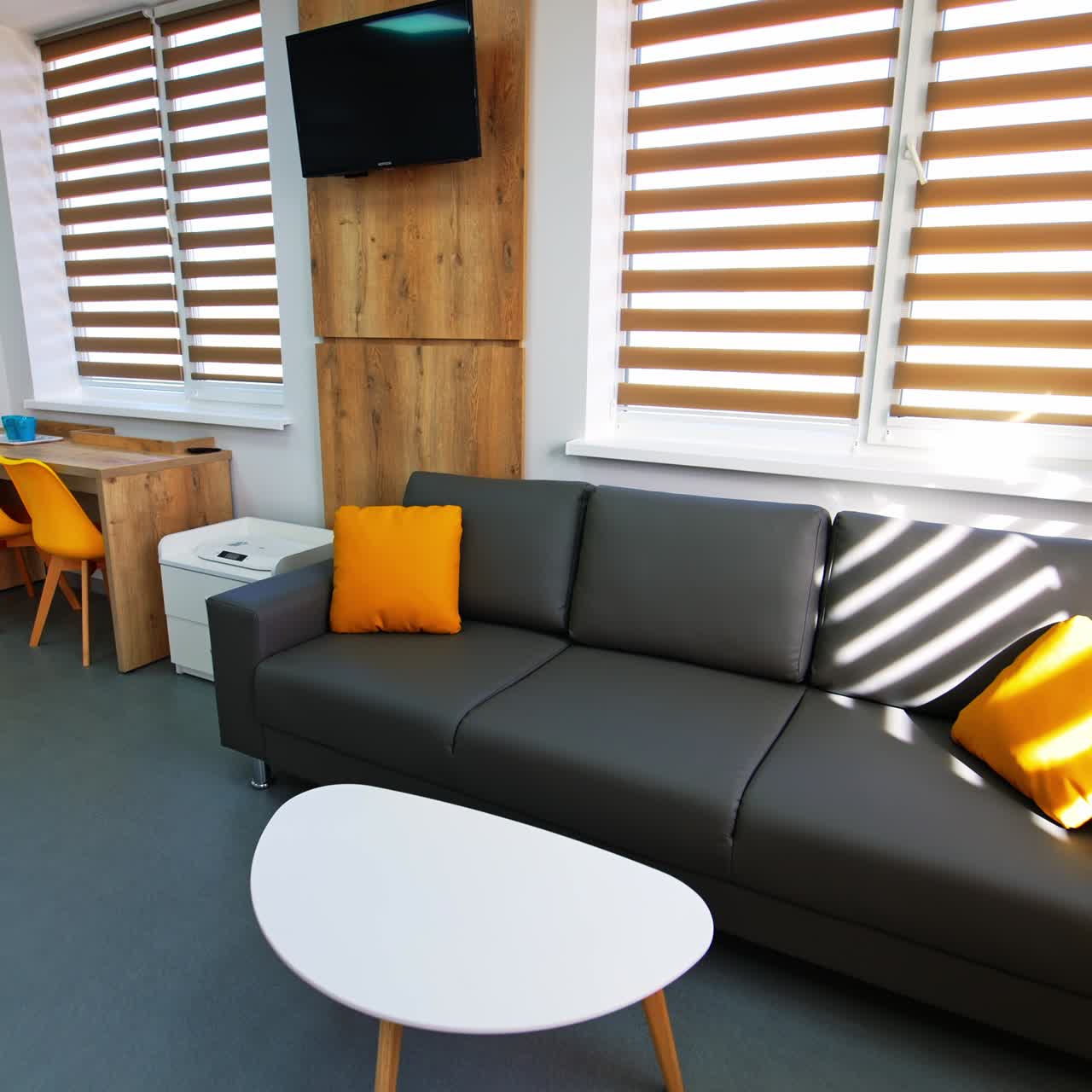 Bright furnished chamber for comfortable staying of newly made parents and babies. Cozy room with beautiful design in maternity hospital