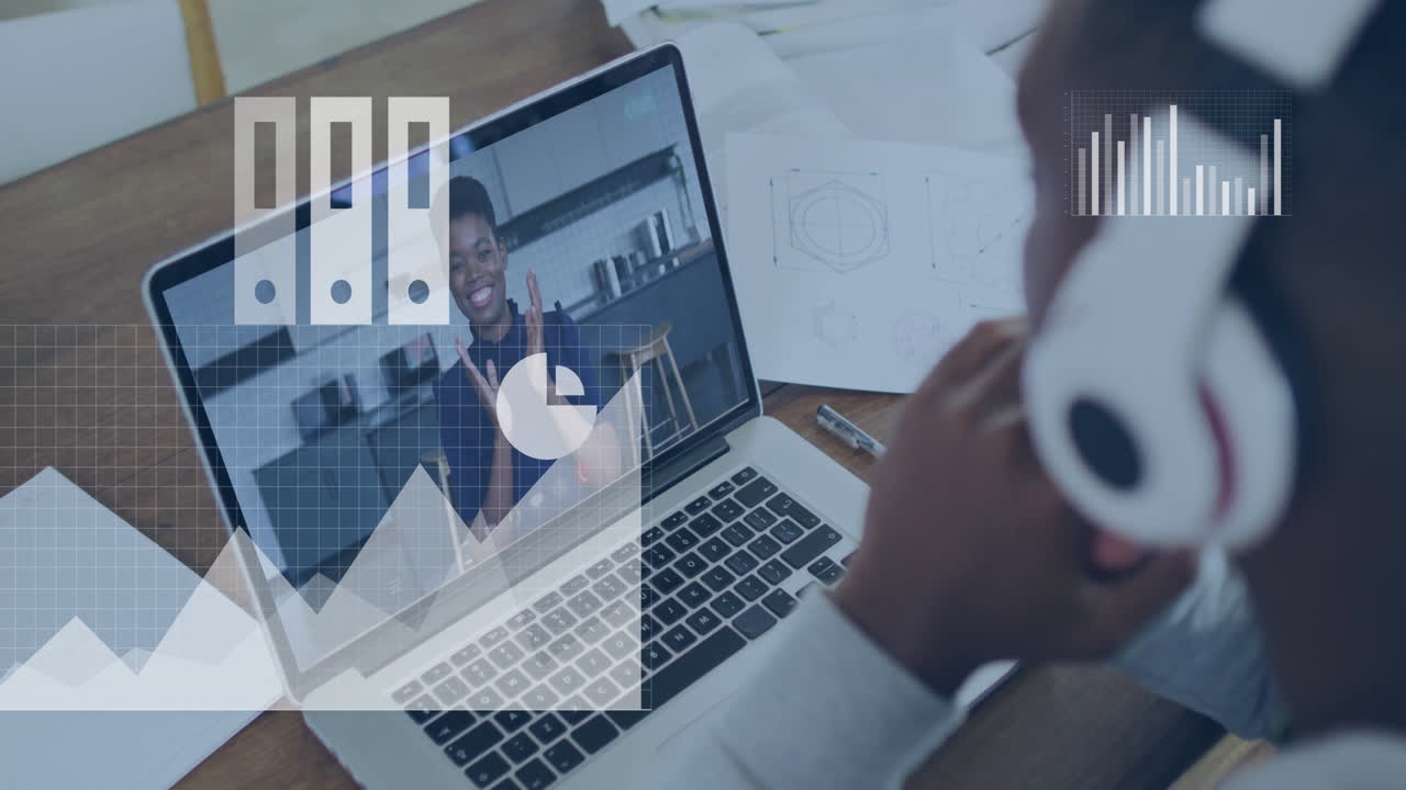 Using laptop for video conferencing with data analytics animation overlay