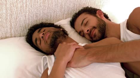 gay couple relaxing in the bed