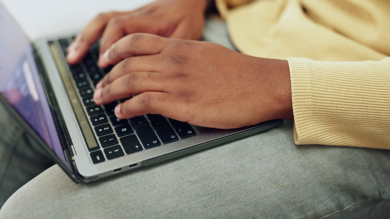 Typing, laptop keyboard and hands of black man
