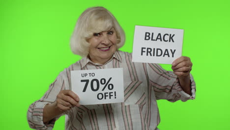 grandmother showing black friday and up to 70 percent off shopping price discount advertisement