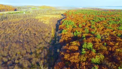 oka national park in quebec, canada and sunset during the changing of the seasons in autumn. slow panning shot at sunset