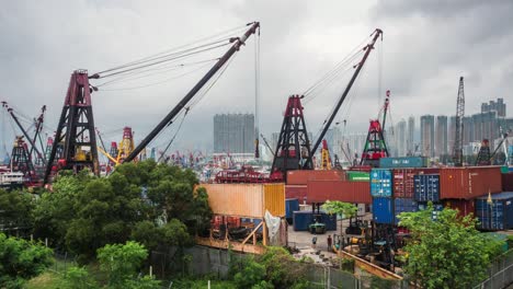 timelapse view of workers at container port in hong kong, china, one of the busiest ports in the world