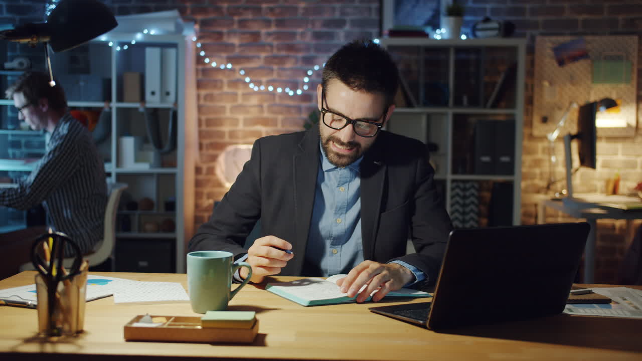 Businessman Working Late at Night in the Office