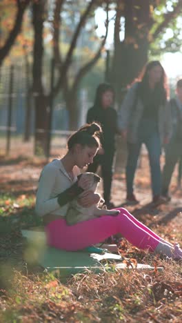 girl with pug in autumn park