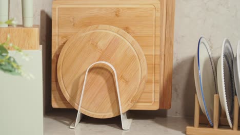organized kitchen counter with cutting boards and dishes