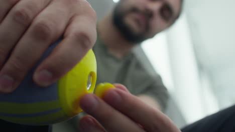 man putting on prosthetic socket
