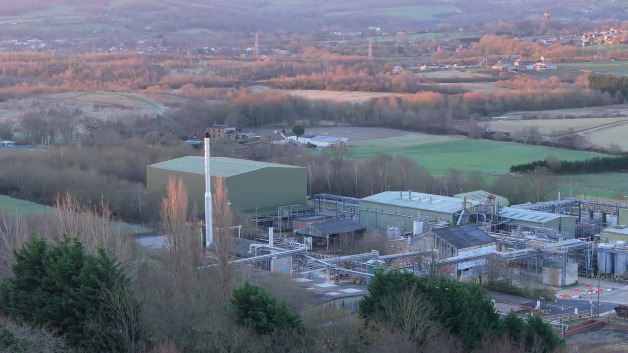 Aerial video footage of industrial buildings and housing