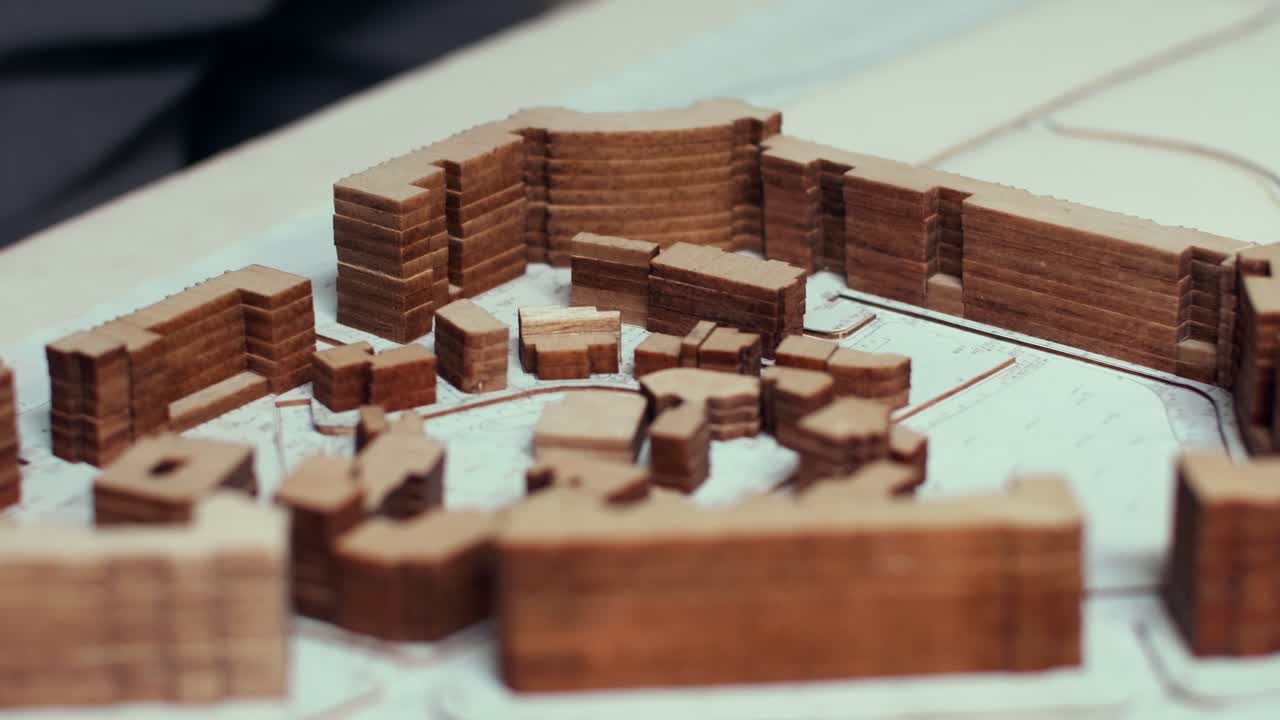 Close up of architect hand moving over city model