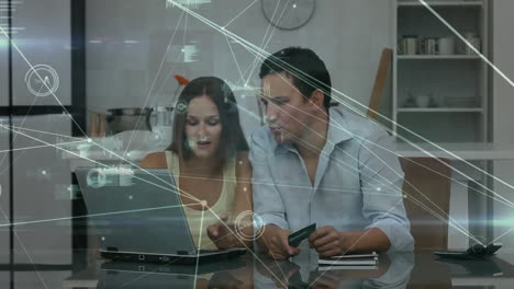 Animation-of-network-of-connections-over-caucasian-couple-using-laptop