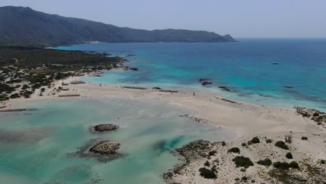 ocean lagoon at elafonissi beach in crete greece panorama, aerial dolly zoom out shot