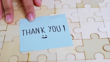 a heartfelt thank you note placed a puzzle symbolizes gratitude and connection