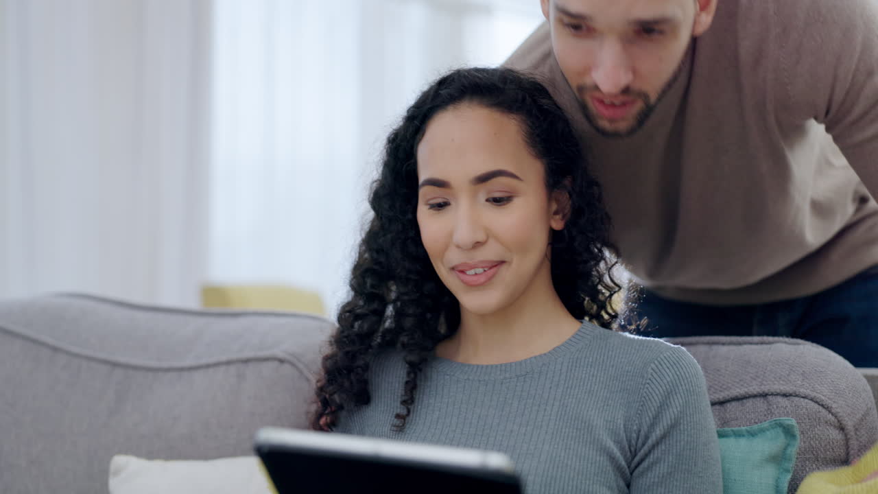 Couple, talking and relax on tablet on sofa